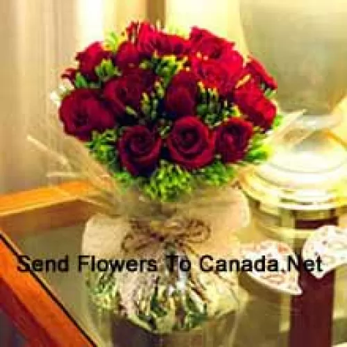 11 Red Roses With Some Ferns In A Vase