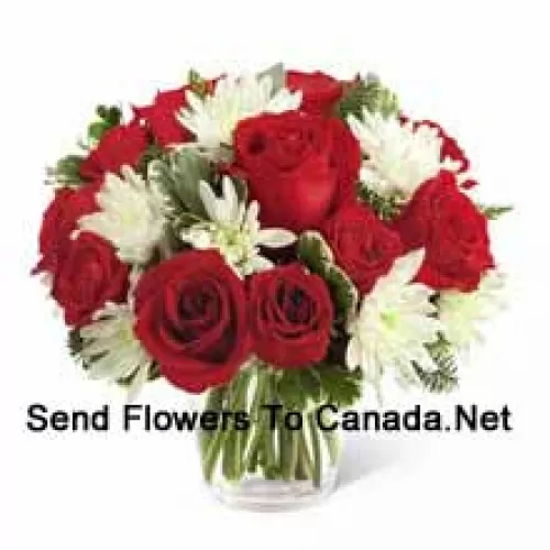 This Bouquet?is a charming display of holiday beauty and winter warmth. Rich red roses and spray roses pop against white chrysanthemums, assorted Christmas greens and eucalyptus, arranged in a round clear glass vase to create a gift that will spread the goodwill of the season to your special recipient. (Please Note That We Reserve The Right To Substitute Any Product With A Suitable Product Of Equal Value In Case Of Non-Availability Of A Certain Product)