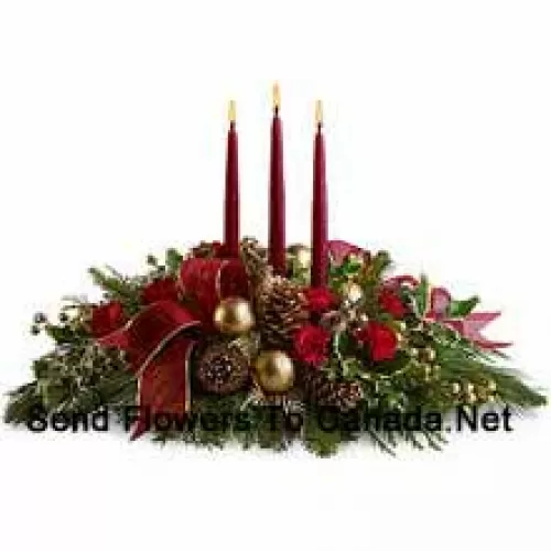 Red miniature carnations, pinecones, golden ornament balls, faux berries and assorted fresh evergreens? accented with a wired ribbon are arranged in a?low dish?with three red taper candles. (Please Note That We Reserve The Right To Substitute Any Product With A Suitable Product Of Equal Value In Case Of Non-Availability Of A Certain Product)